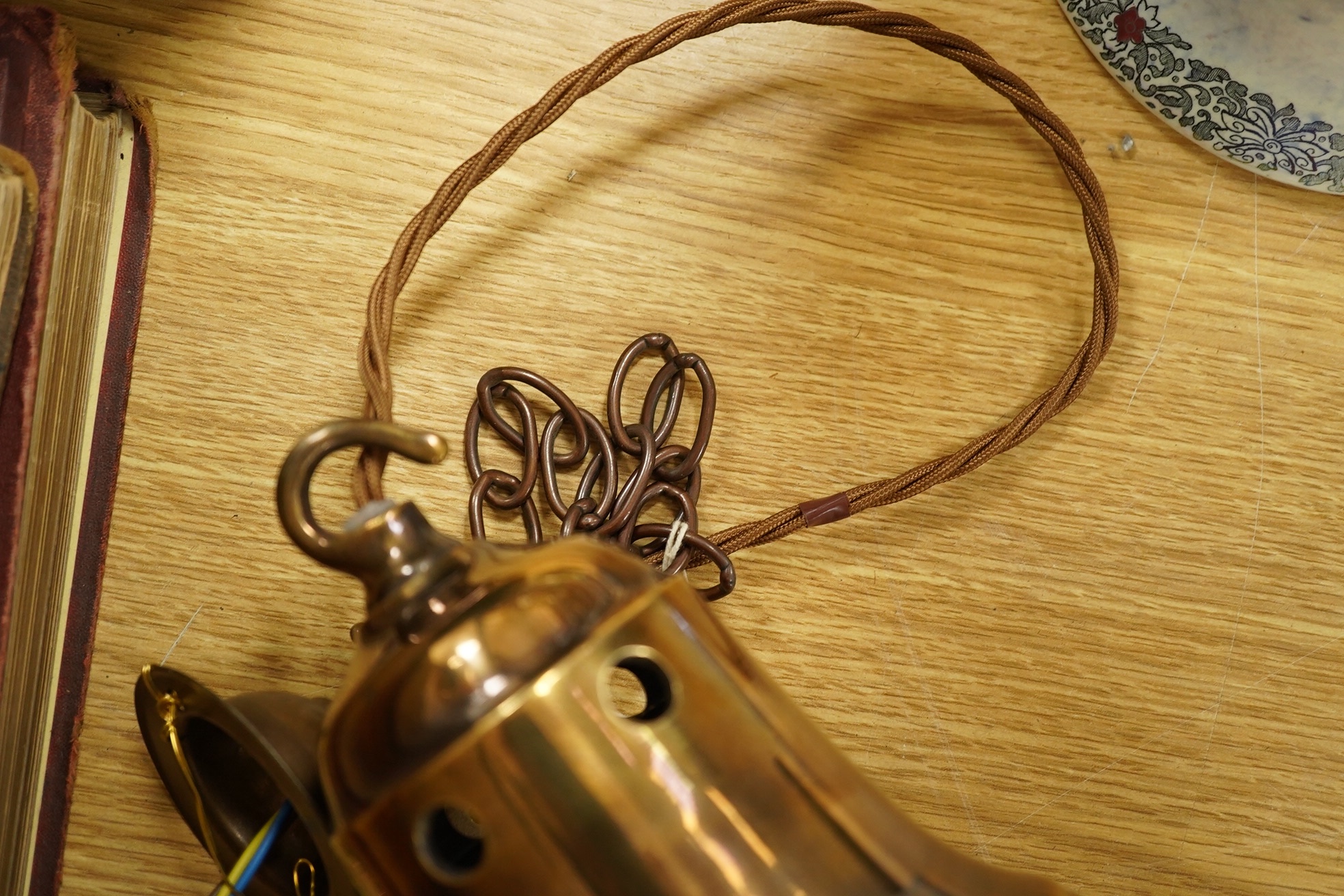 A Retro pendant including crinkle glass, antique brass gallery, chain and ceiling rose, circa 1960's -1970's, wired, glass 38cm high to top of gallery. Condition - fair to good